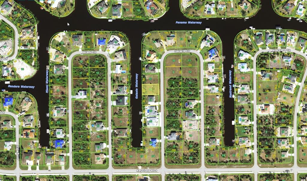 This is an aerial map showing residential lots and waterways in a suburban neighborhood — 9316 GALAXIE CIRCLE, PORT CHARLOTTE, FL