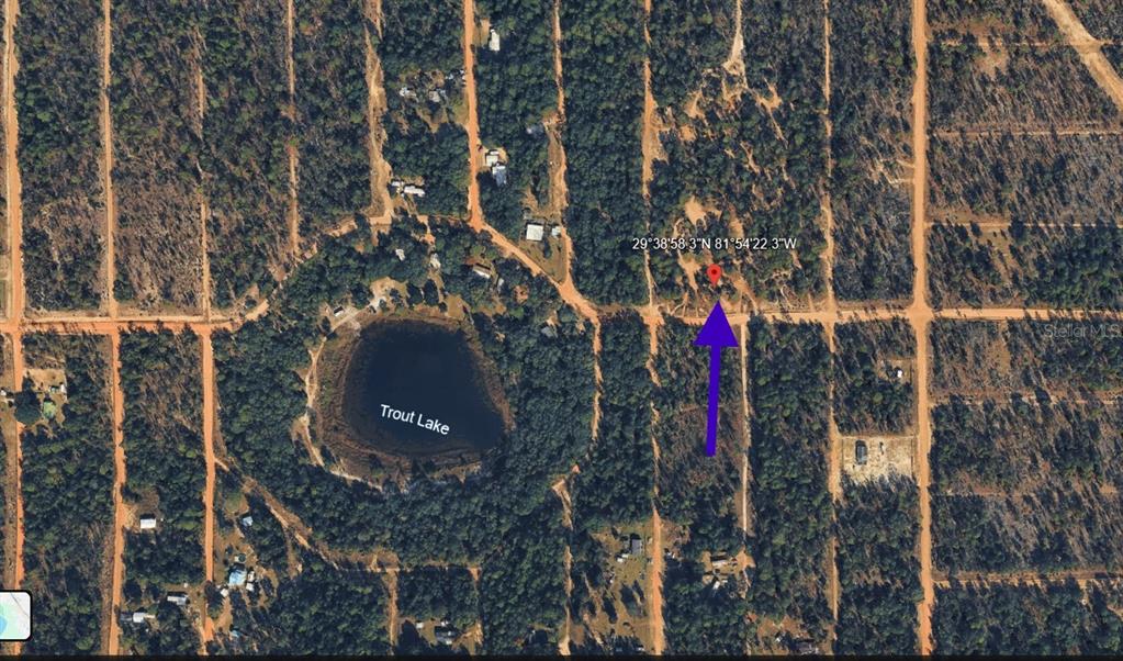 An aerial map view shows a wooded lot located near Trout Lake — 1402 TWIN LAKES BLVD, INTERLACHEN, FL
