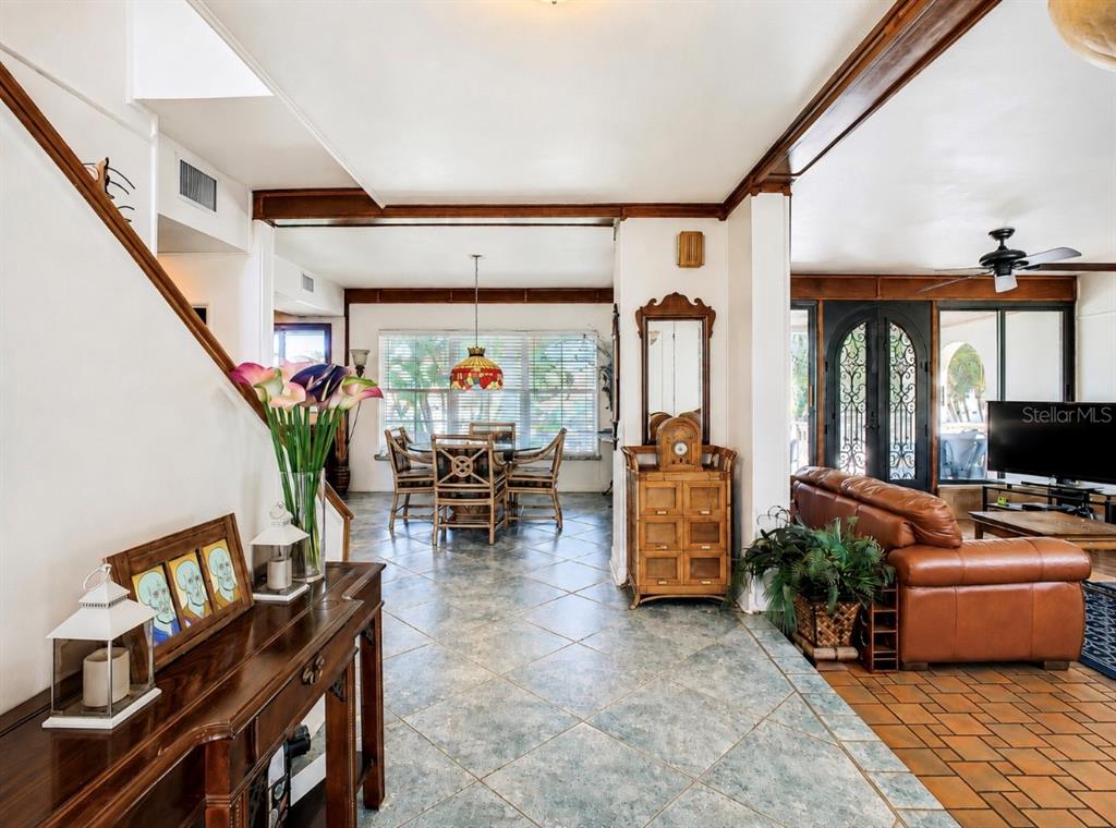 A view from a foyer looking into a dining area and a living room — 4929 N RIVER SHORE DRIVE, TAMPA, FL