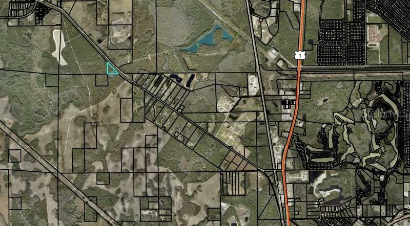 This is an aerial map showing a highlighted parcel of land near a highway — 1925 CR-13, BUNNELL, FL