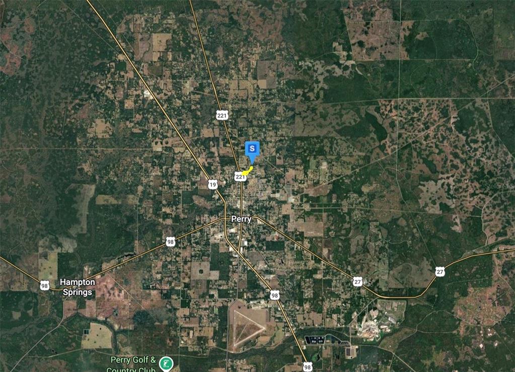 This is a satellite map showing the town of Perry, Florida, with a location marker — 400 E ELM STREET, PERRY, FL