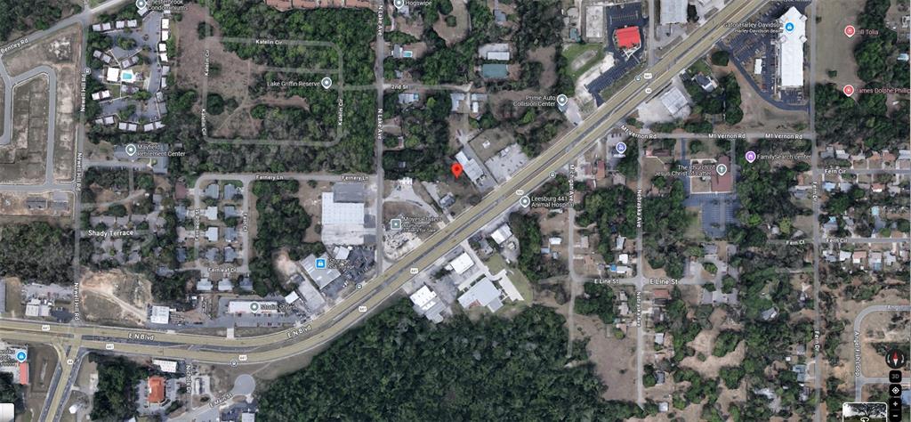This is an aerial map view of a property located along a highway — 1602 E MAIN STREET, LEESBURG, FL