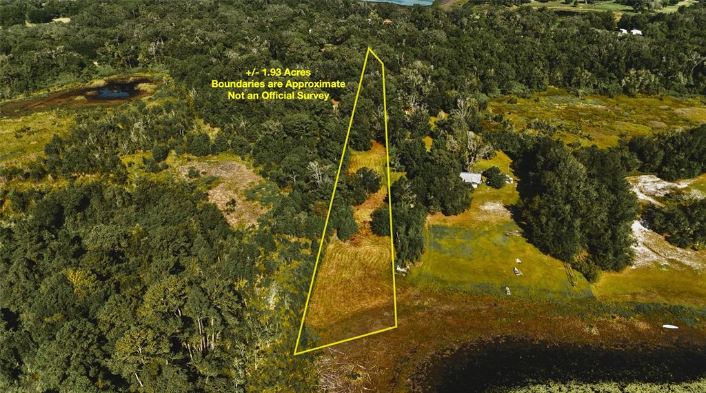 An aerial view shows a wooded lot with an approximate boundary outline near a lake — 00 HALL LAKE ROAD, KEYSTONE HEIGHTS, FL