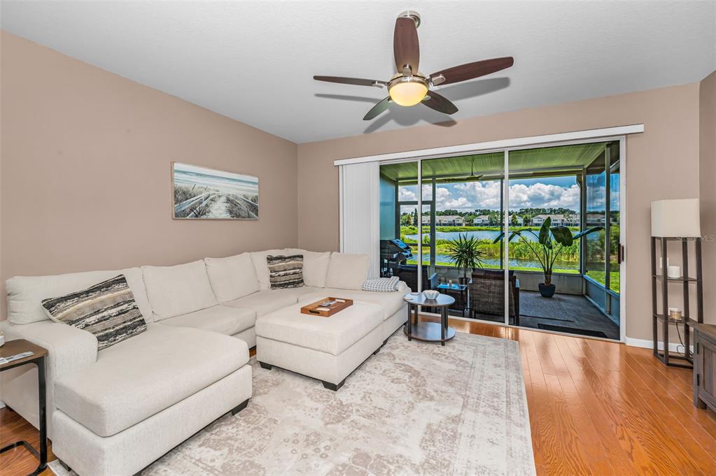 A gated entrance with brick pillars and mature trees leads into a residential community — 10155 HAVERHILL RIDGE DRIVE, RIVERVIEW, FL