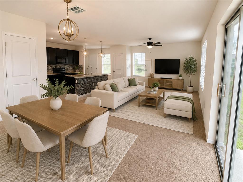 A bright entryway features a white door, a gold-framed mirror, and a slim console table — 32649 PEZ LANDING LANE, WESLEY CHAPEL, FL