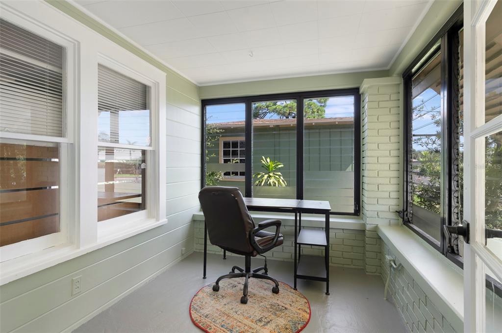 A single-story house with a brick and light-colored siding exterior and a front porch — 2521 4TH STREET S, ST PETERSBURG, FL