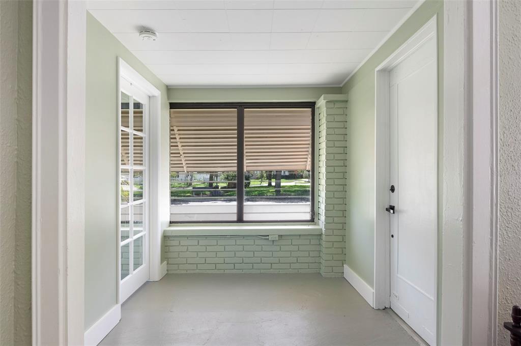 A single-story house with a brick facade, a front porch, and a stone walkway — 2521 4TH STREET S, ST PETERSBURG, FL