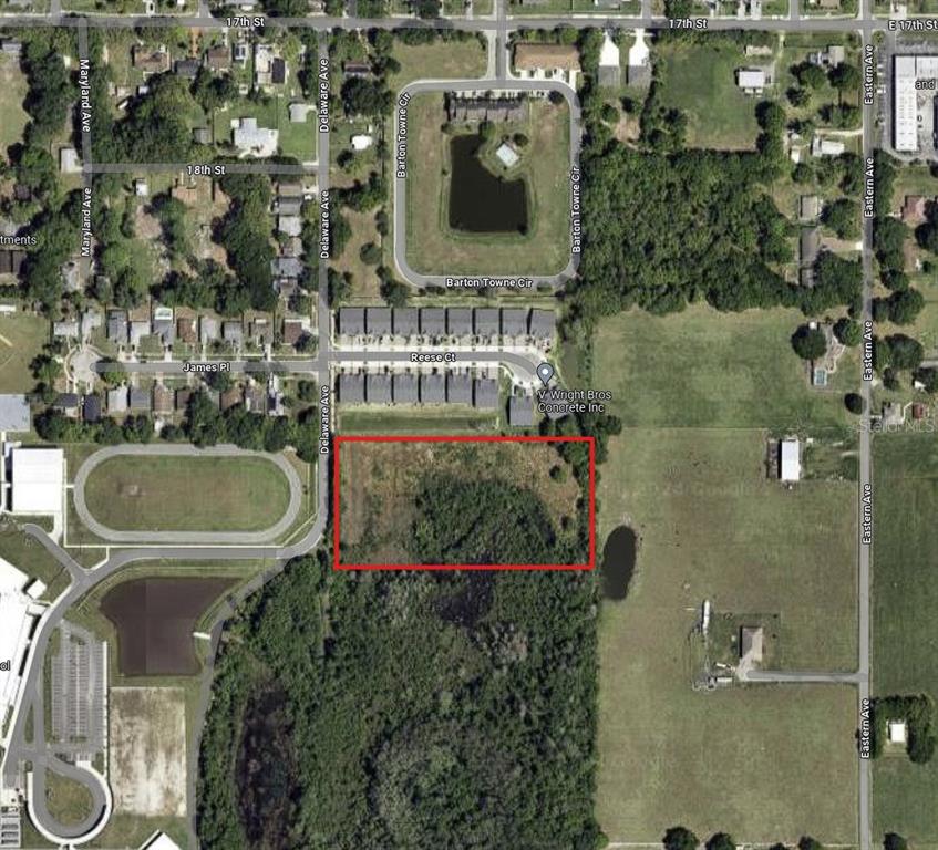 An aerial map view shows a rectangular vacant lot outlined in red near residential streets — 0 DELAWARE AVENUE, ST CLOUD, FL