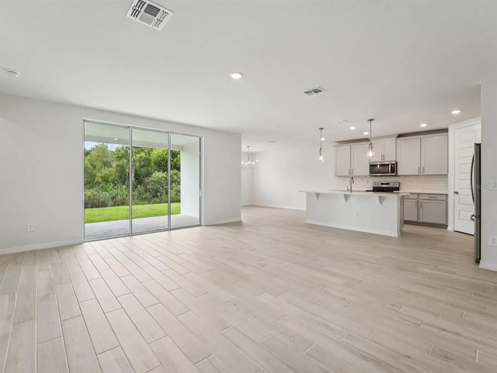 This is a floor plan for a single-story house with four bedrooms and a garage — 3313 ORCHARD LOOP, BARTOW, FL