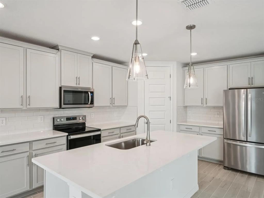 This rendering shows a dining room with a dark wood table, chairs, and tile flooring — 3313 ORCHARD LOOP, BARTOW, FL