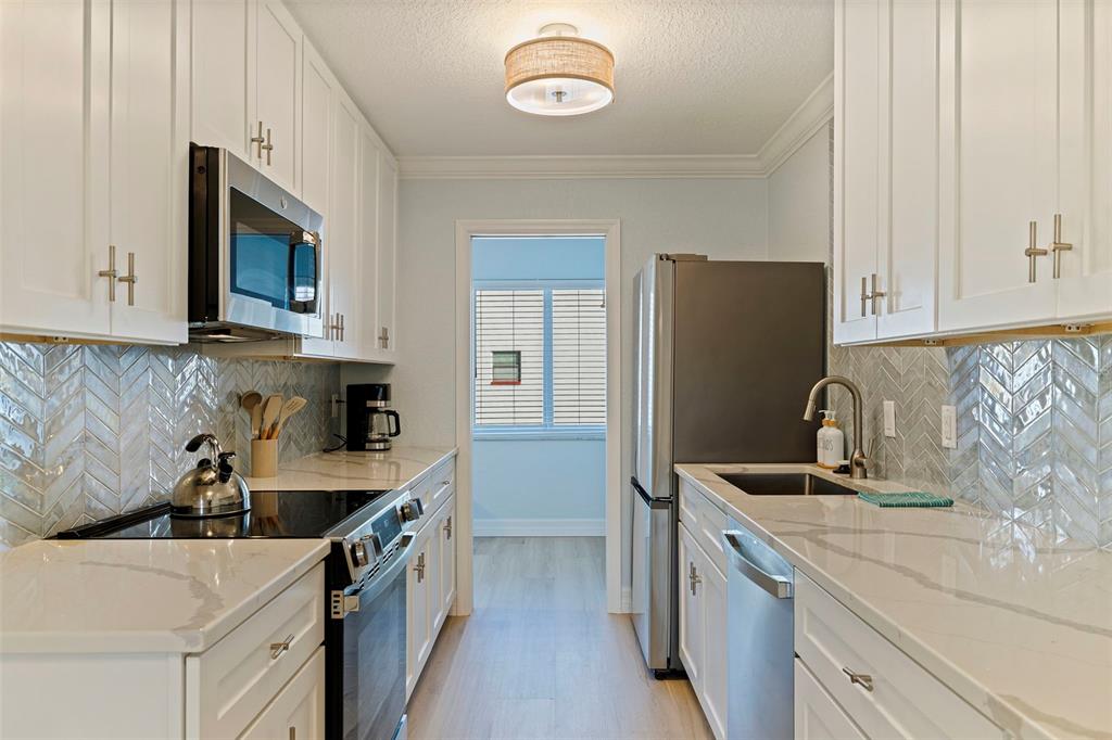 10265 GULF BOULEVARD UNIT A303, TREASURE ISLAND, FL — photo 4 of 22