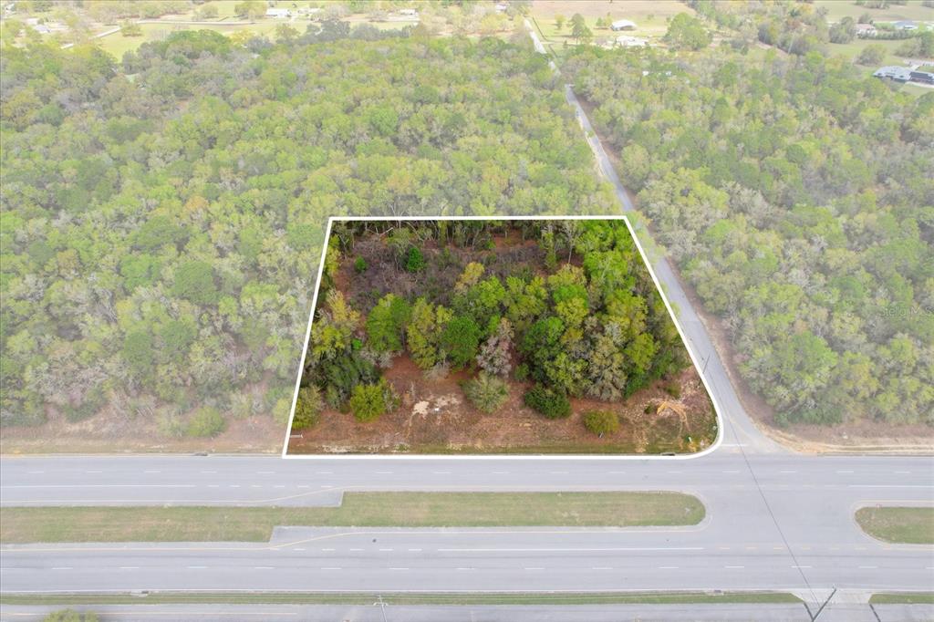 This is an aerial map showing a commercial property located along W Norvell Bryant Hwy — 161 W NORVELL BRYANT HIGHWAY, HERNANDO, FL