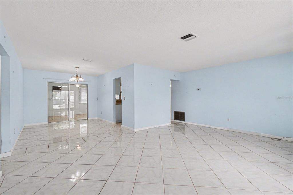 A single-story house with a beige stucco exterior, arched porch, and an attached garage — 6535 MARIUS ROAD, NORTH PORT, FL