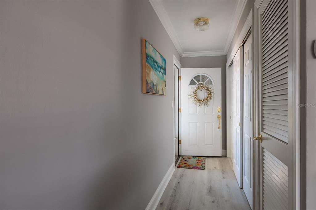 An outdoor balcony with light blue walls, a white railing, and a tiled floor — 6161 GULF WINDS DRIVE UNIT 338, ST PETE BEACH, FL
