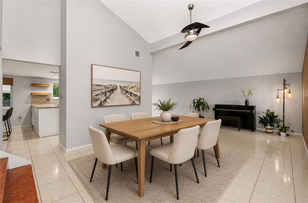 The exterior of a house features a tiled entryway, dark double doors, and white stucco walls — 1304 ORTEGA STREET, WINTER SPRINGS, FL
