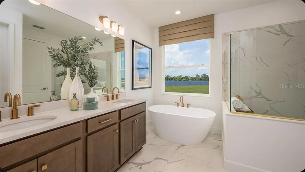 A home office features dark green walls, a light wood sideboard, and a round desk — 5790 BINNACLE LANE, COCOA, FL
