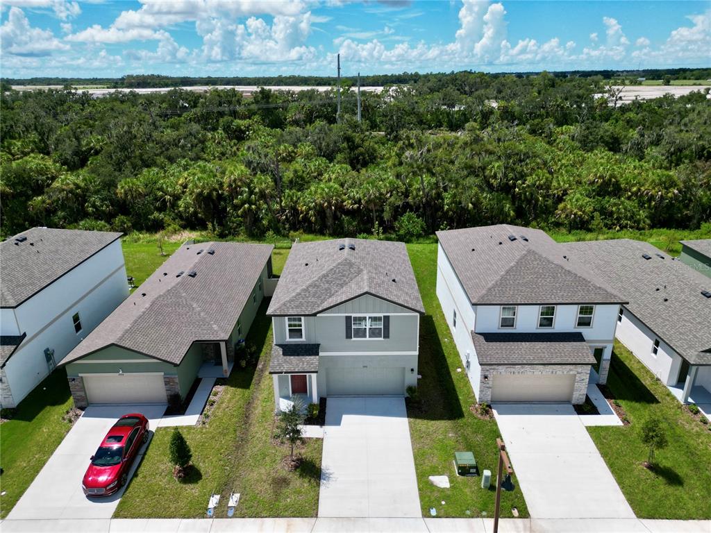 This floor plan shows the first level of a home with a garage and patio — 10510 CURVING CREEK LOOP, PARRISH, FL