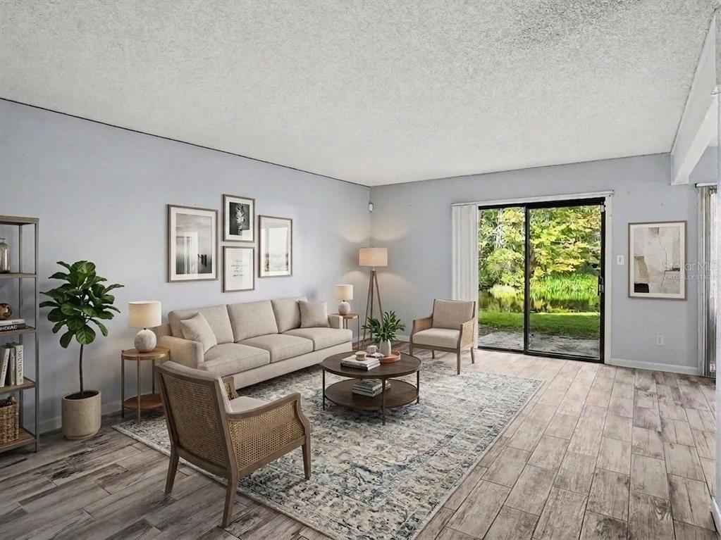 A kitchen with wood cabinets, laminate countertops, and an adjacent laundry area with white appliances — 4828 PEBBLE BEACH DRIVE UNIT A1108, ORLANDO, FL