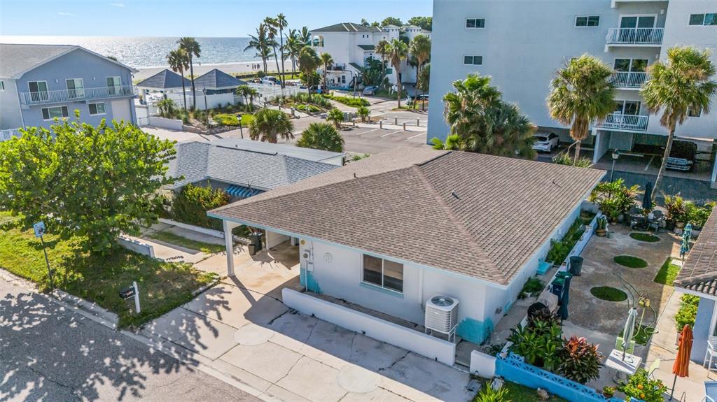 An aerial view of a single-story house with a brown roof near the beach — 18317 SUNSET BOULEVARD, REDINGTON SHORES, FL