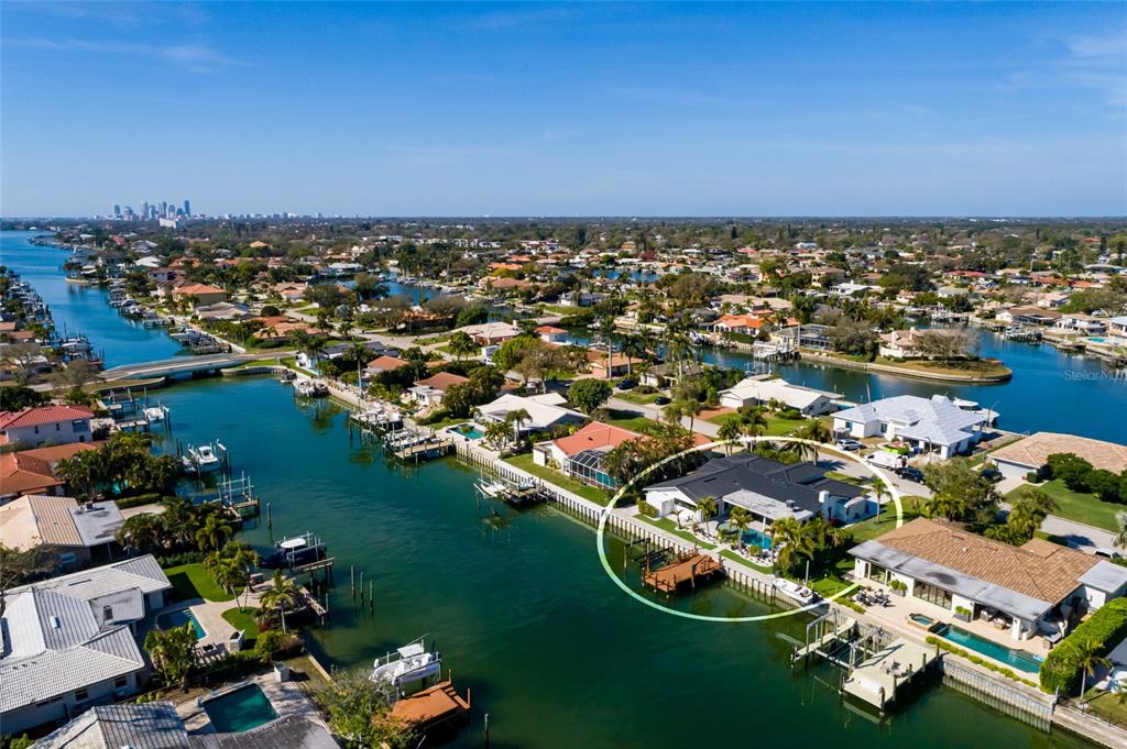 An aerial view of a waterfront house with a private dock and swimming pool — 2032 KANSAS AVENUE NE, ST PETERSBURG, FL