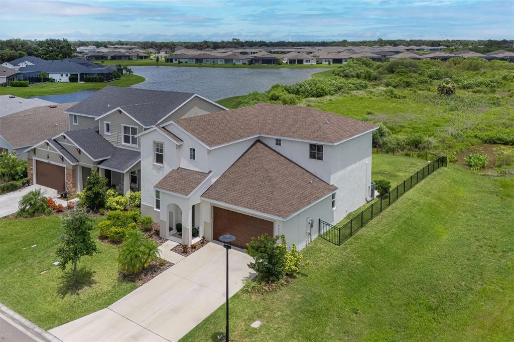 An aerial view of a two-story suburban house with a brown roof and attached garage — 11124 MOONSAIL DRIVE, PARRISH, FL