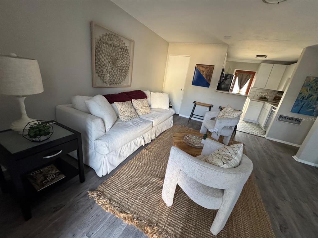 A dark gray front door with the number 118 above it sits next to a window — 151 N ORLANDO AVENUE UNIT 118, WINTER PARK, FL