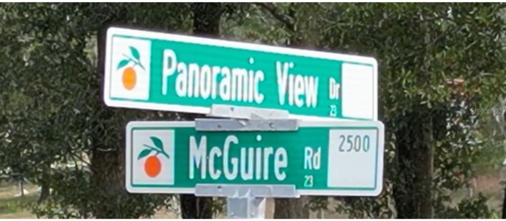 A street sign shows the intersection of Panoramic View Drive and McGuire Road — 5542 PANORAMIC VIEW DRIVE, APOPKA, FL