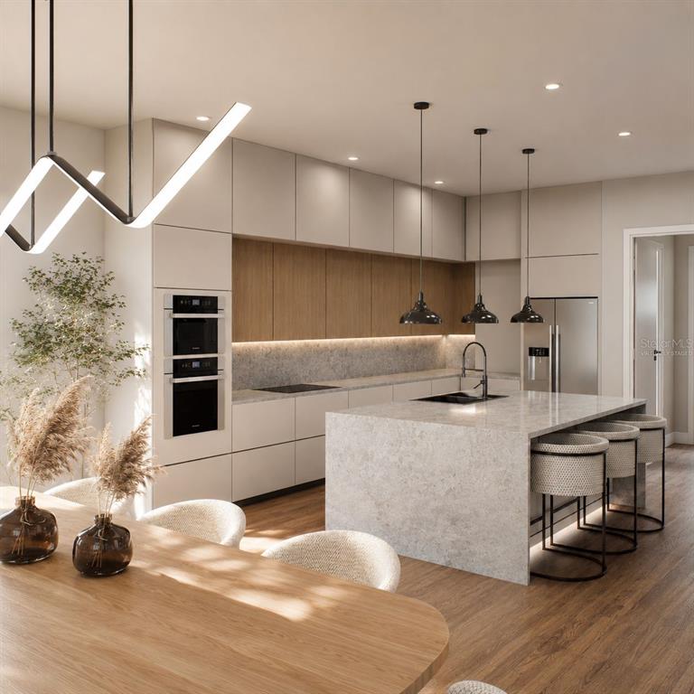 This is a rendering of a modern kitchen featuring light cabinetry, wood accents, and an island — 19215 NUTMEG ST, ORLANDO, FL