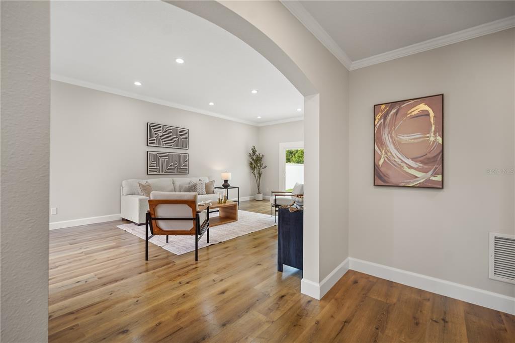 A two-story house with a dark mansard roof, white stucco walls, and a two-car garage — 2186 COUNTRYSIDE CIRCLE N, ORLANDO, FL