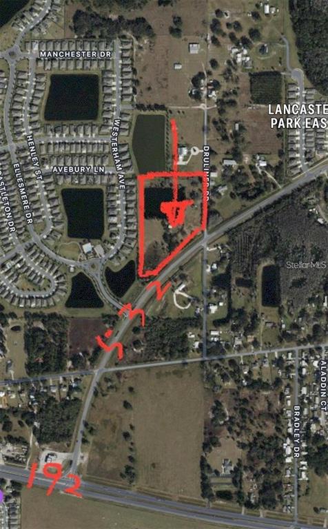 An aerial map shows a highlighted parcel of land near a highway and residential neighborhood — 1888 DRULINER ROAD, ST CLOUD, FL