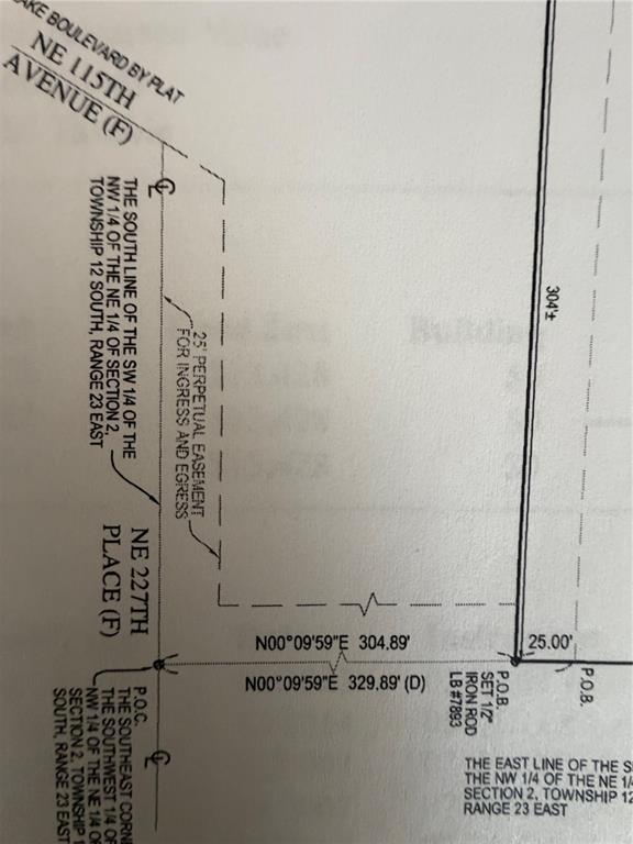 This image is a survey map showing property boundaries and a perpetual easement for ingress — TBD NE 115 AVENUE, FORT MC COY, FL