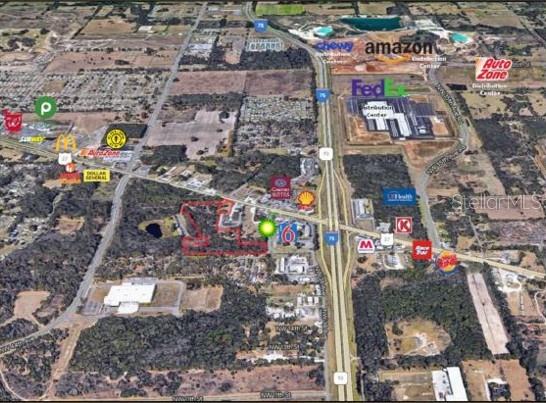 This aerial map shows a commercial property outlined in red near a major highway intersection — 4030 NW BLITCHTON ROAD, OCALA, FL