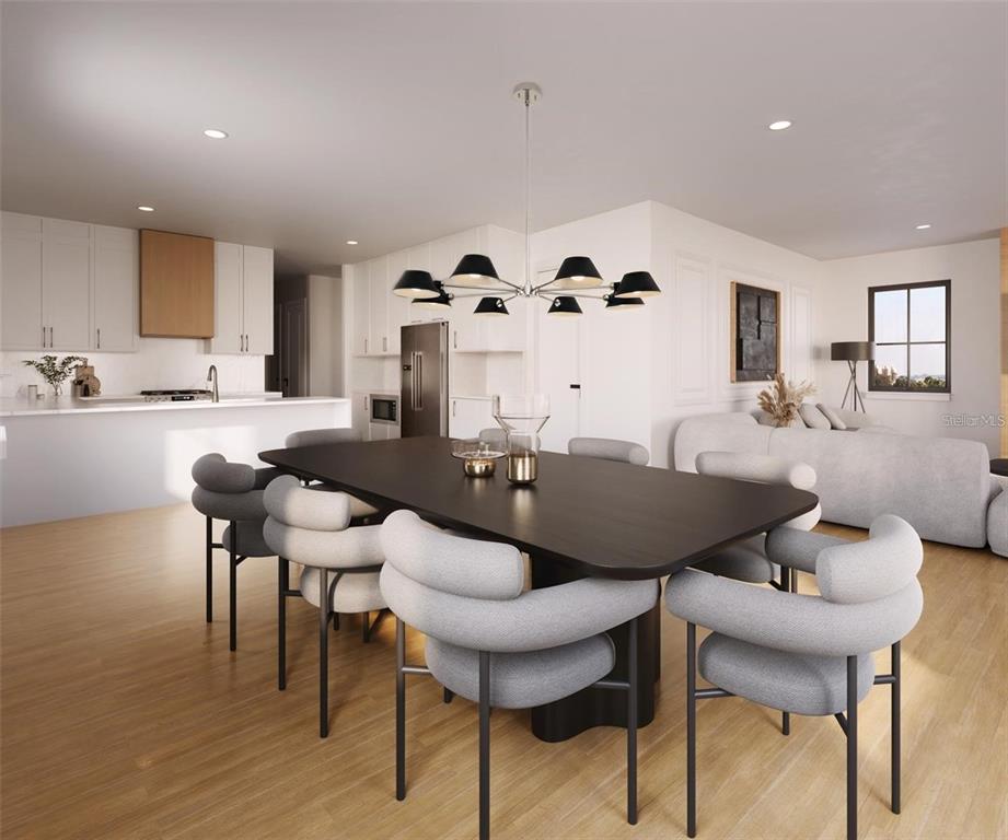 This is a rendering of an open-concept dining room and kitchen with modern furniture — 642 MEDORA WAY, WINTER GARDEN, FL
