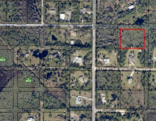An aerial map view shows a vacant rectangular lot outlined in red among wooded residential properties — 3305 WEBER ROAD, GRANT VALKARIA, FL