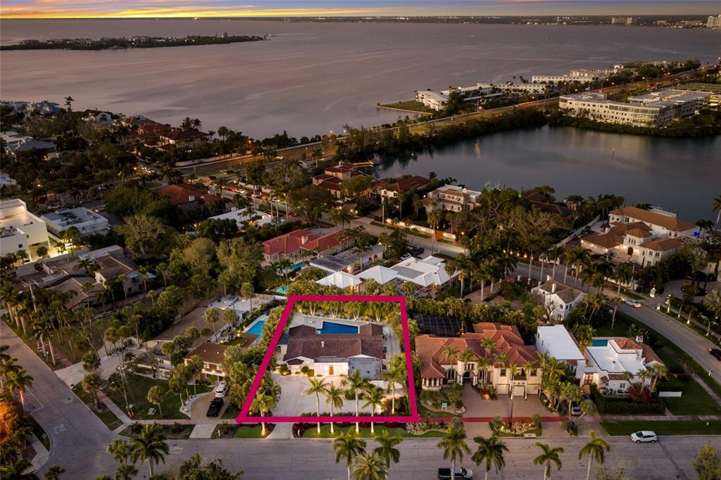 An aerial view shows a single-story house with a pool inside a highlighted property boundary — 103 FILLMORE DRIVE, SARASOTA, FL