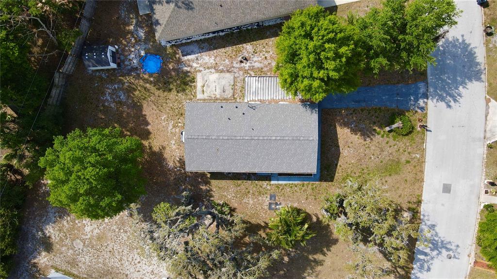 A light gray, single-story house with a white picket fence and a screened-in porch — 111 NE PALENCIA ROAD, AUBURNDALE, FL