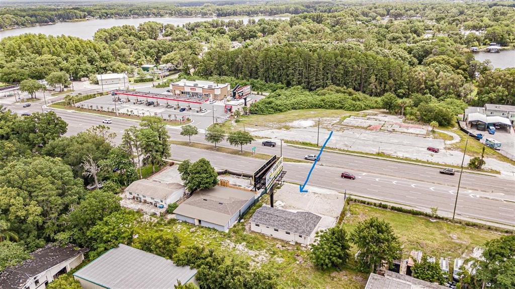 An aerial view shows two commercial buildings on a lot with a large billboard — 4623 LAND O LAKES BOULEVARD, LAND O LAKES, FL