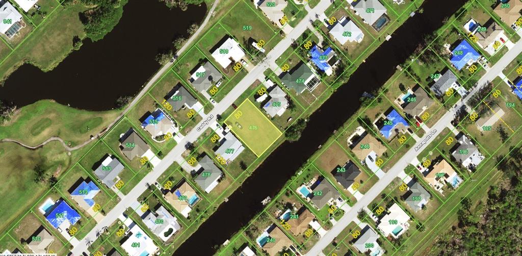 This is an aerial map showing a vacant lot highlighted in yellow among residential properties — 41 CADDY RD, ROTONDA WEST, FL