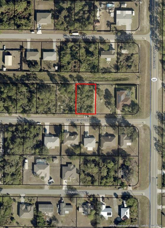This is an aerial map showing a vacant lot outlined in red on a residential street — 1681 WALDREP STREET SE, PALM BAY, FL
