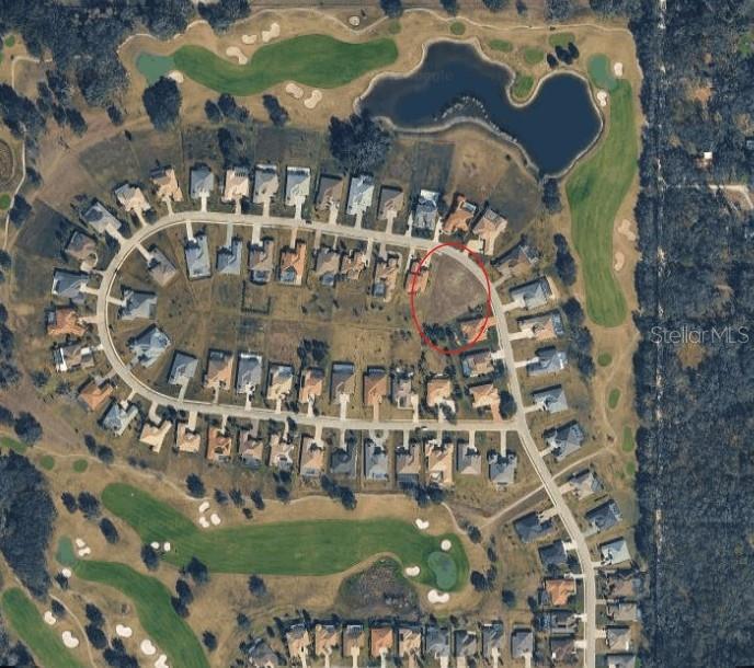 This aerial map shows a vacant residential lot circled in a golf course community — 13729 CARRYBACK DRIVE, DADE CITY, FL