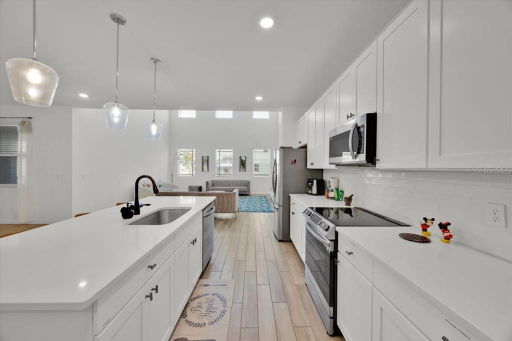 This floor plan shows a first-floor layout with a living room, two bedrooms, and a garage — 2342 LANCASHIRE STREET, DAVENPORT, FL