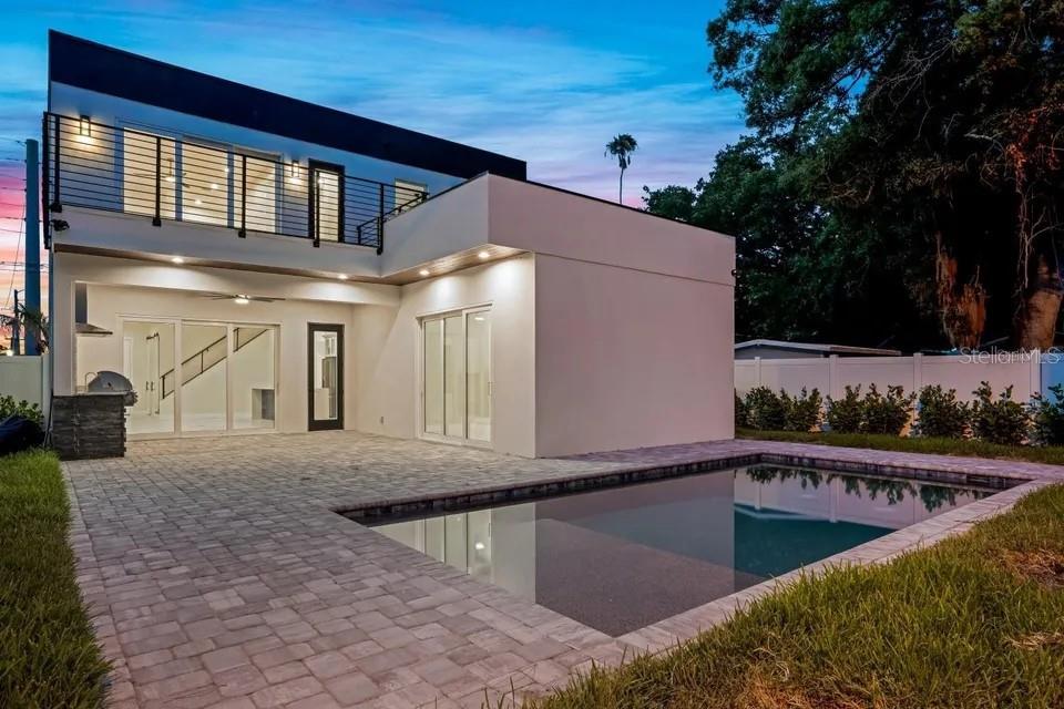 This is a floor plan of a home featuring a primary suite and open living area — 1156 COCOANUT AVENUE, SARASOTA, FL