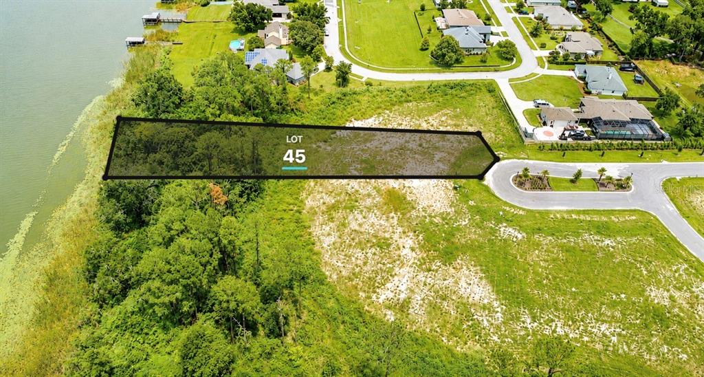 An aerial view shows a vacant, wooded lot labeled 45 bordering a lake and road — 552 WALKER STREET, OAKLAND, FL