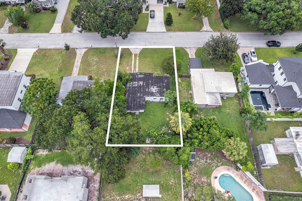 An aerial view shows a house with a dark roof centered on a rectangular lot — 1416 BORDER DRIVE, WINTER PARK, FL