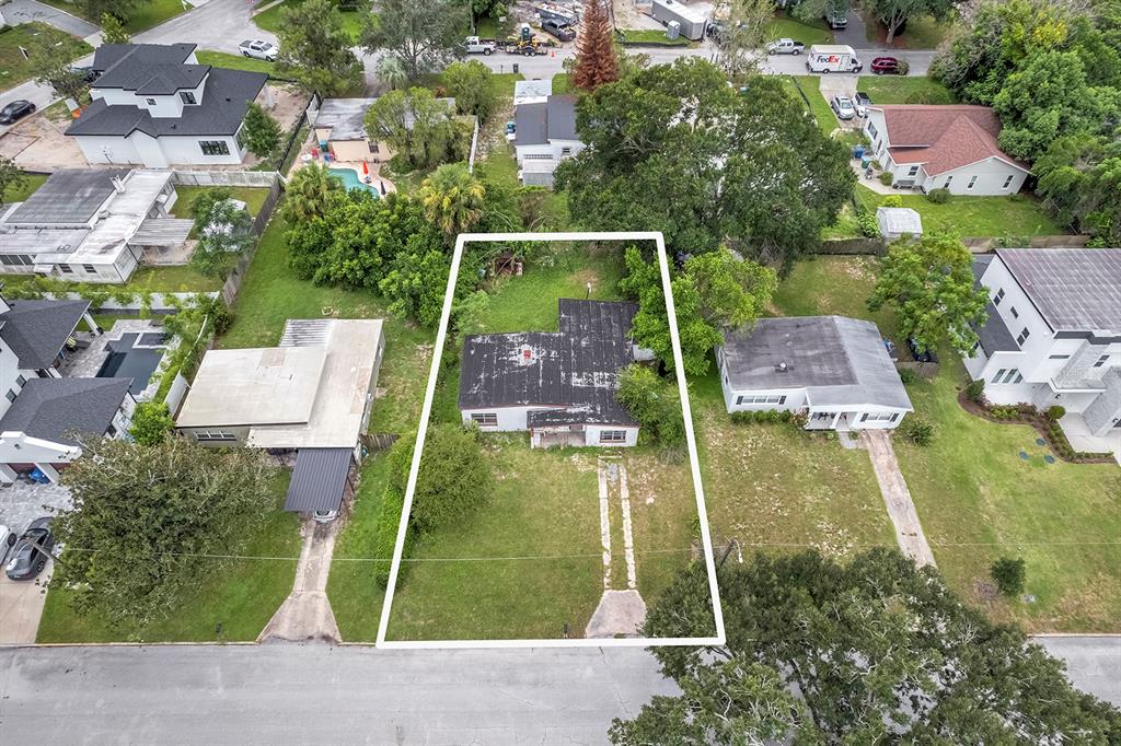 An aerial view shows a single-story house with a flat roof on a rectangular lot — 1416 BORDER DRIVE, WINTER PARK, FL