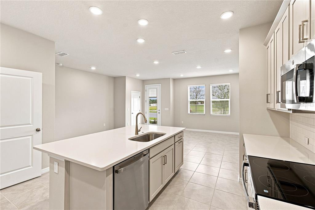 This is a floor plan for the upper level of a home featuring three bedrooms — 5592 COOPERS HAWK CT, ST CLOUD, FL