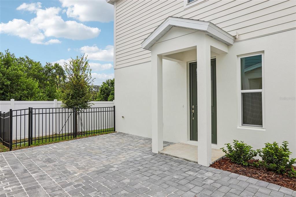 A carpeted staircase with a black metal railing leads to an upper floor in a home — 607 SILVER STREAM COURT, BRANDON, FL