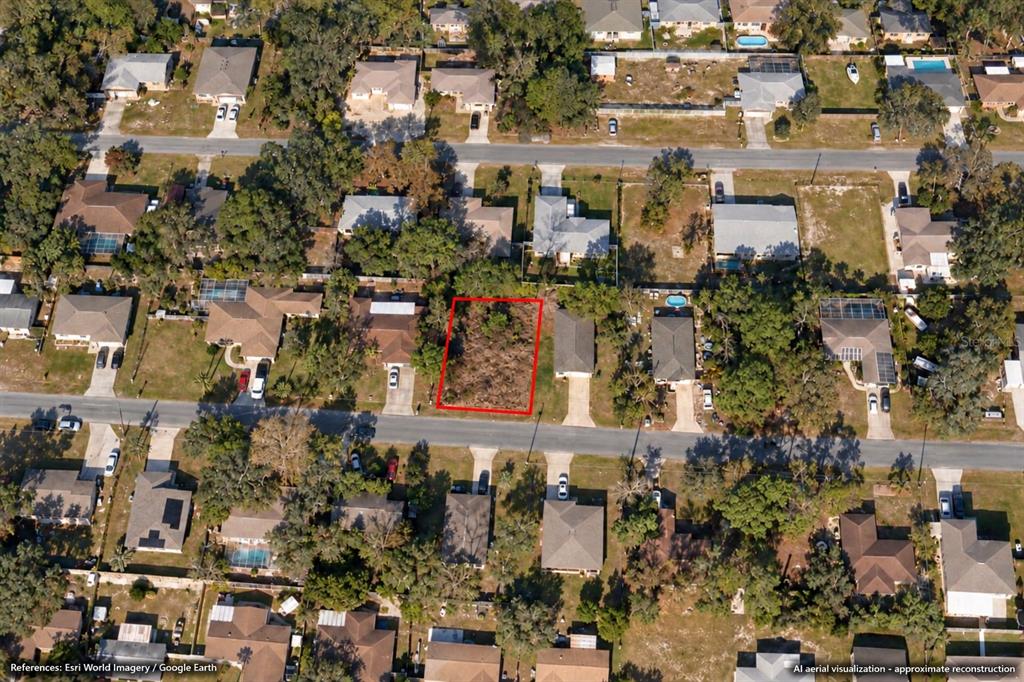 This is an aerial map showing a vacant lot highlighted in red on Mohawk Trail — 7453 MOHAWK TRAIL, SPRING HILL, FL
