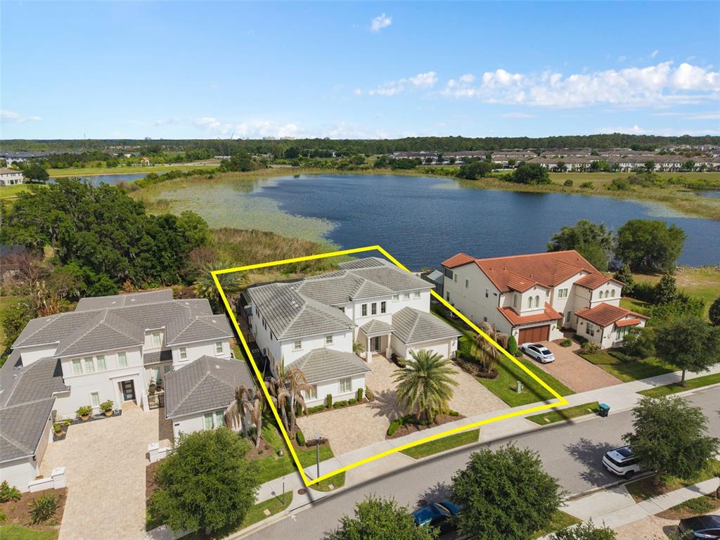 An aerial view shows a residential neighborhood with houses, lakes, and a red location pin — 15522 SHOREBIRD LANE, WINTER GARDEN, FL