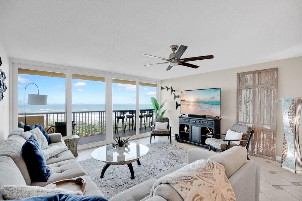An outdoor apartment hallway features a white door labeled 1005 and several windows — 257 MINORCA BEACH WAY UNIT 1005, NEW SMYRNA BEACH, FL
